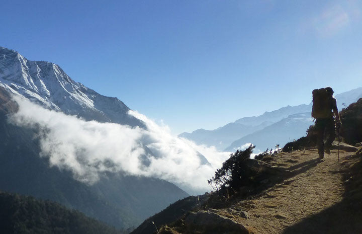 person hiking big mountain